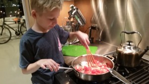 Max softening his tomatoes for his shrimp dish