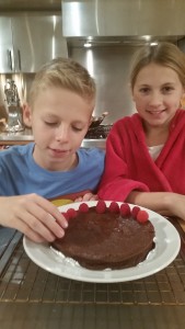 Finishing touches: Adding fresh raspberries to the cake