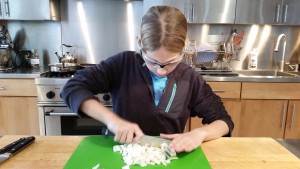 Chopping onions for the chili.