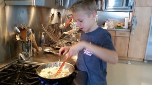 Sauteing the onions and turkey before placing them in the Chili.