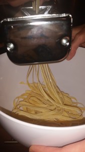 Cutting the pasta into fettucine strips