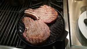 Grilling the steaks (they were so thick, I finished them off in the oven)