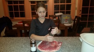 Seasoning the brisket.