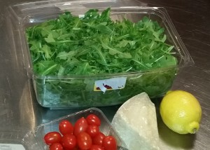 Arugula, parmigiano, grape tomatoes and lemon-olive oil dressing