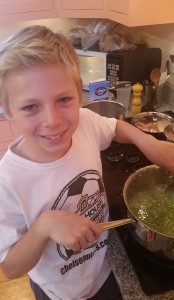 Stirring the Peas into the pan. 