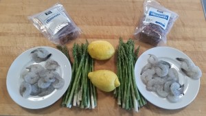 Appetizer ingredients: lemons, asparagus, shrimp and almonds